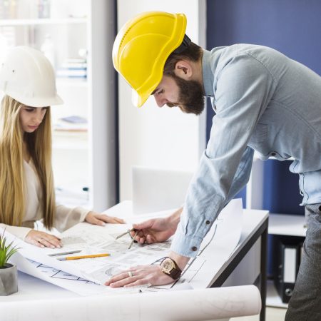 male-engineer-drawing-plan-blue-print-with-architect-equipment